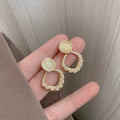 French Cream Cat Eye Pearl Twist Hollow Drop Earrings